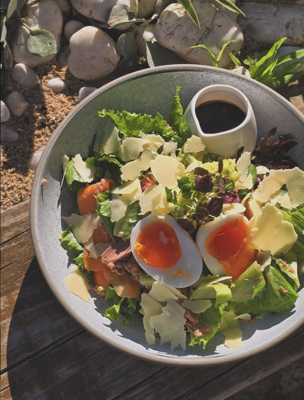 Fresh salad with eggs and shaved cheese